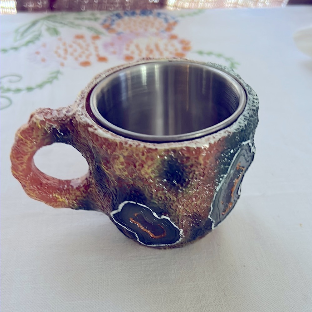 Artistic Ceramic and Metal Mug with Earthy Tones